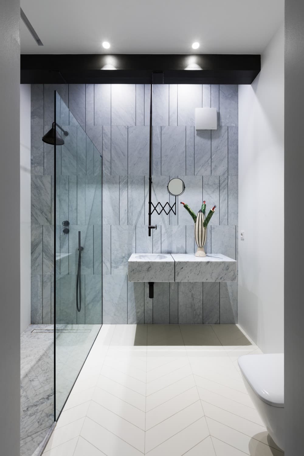 Marble-tile-shower-with-a-vertical-pattern.jpg